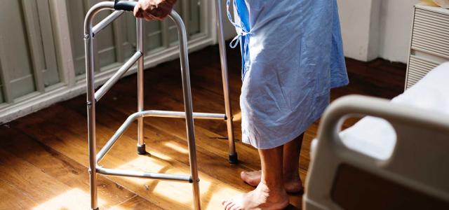 Patient walking with a walker.